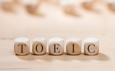 Toeic word on wooden cubes. Toeic concept